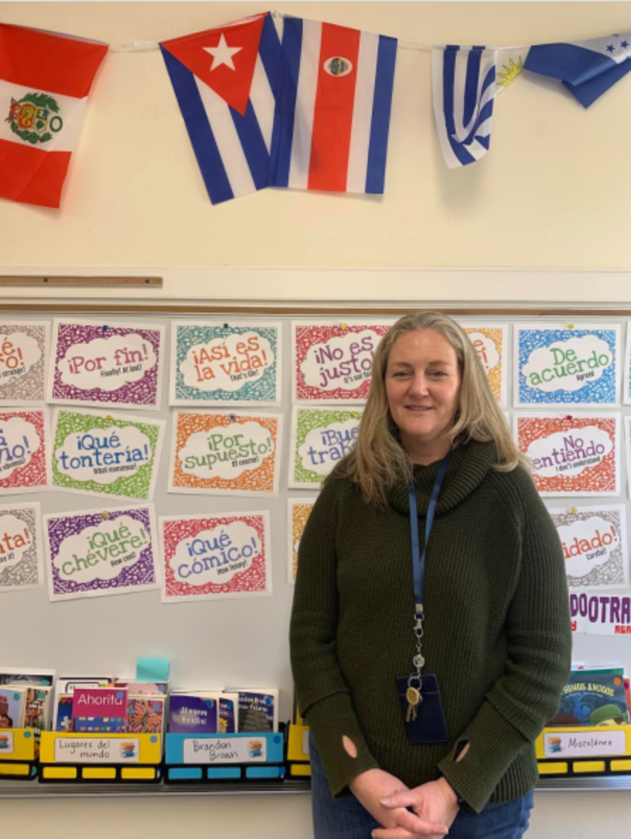 Headshot of Kathryn Blanchard in her classroom where she teaches Spanish.